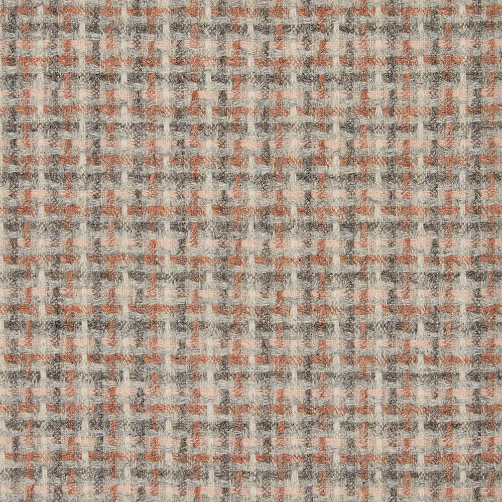 Warm sandstone fabric with small rust and charcoal checks in a textured woven surface