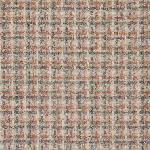 Warm sandstone fabric with small rust and charcoal checks in a textured woven surface