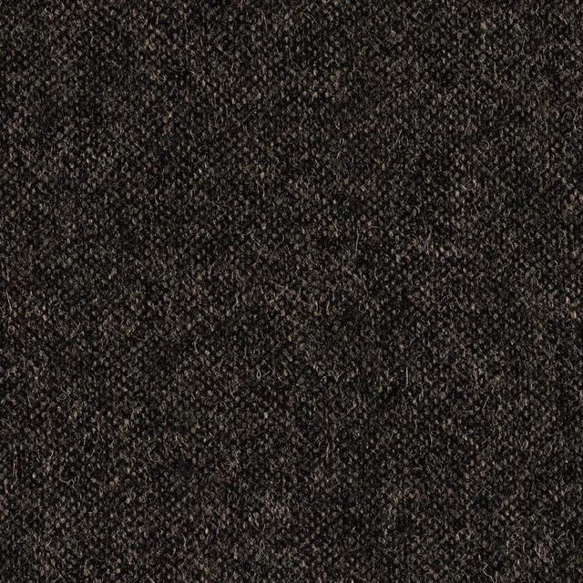 Close-up of dark vintage grey fabric with dense nubby, mottled texture
