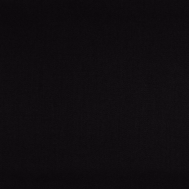 Near-black woven upholstery fabric with subtle tonal texture and matte surface
