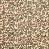 Sage green fabric with repeating red and cream botanical leaf motif