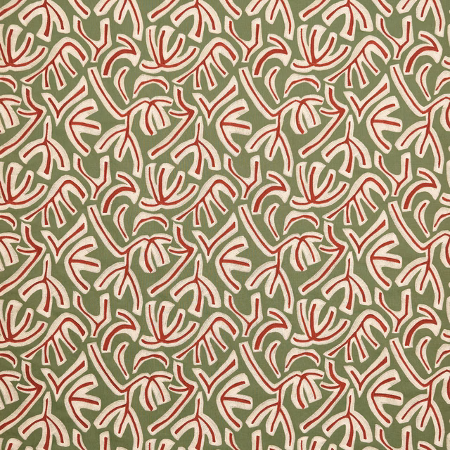 Sage green fabric with repeating red and cream botanical leaf motif