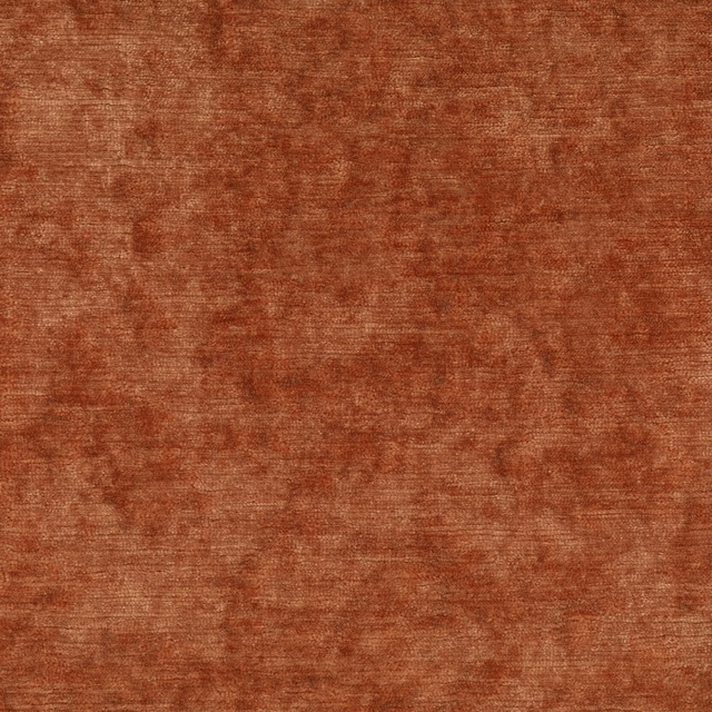 Close-up of a rust terracotta textured fabric with mottled tonal weave