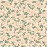 Blush pink floral fabric with trailing green vines and leaf motifs
