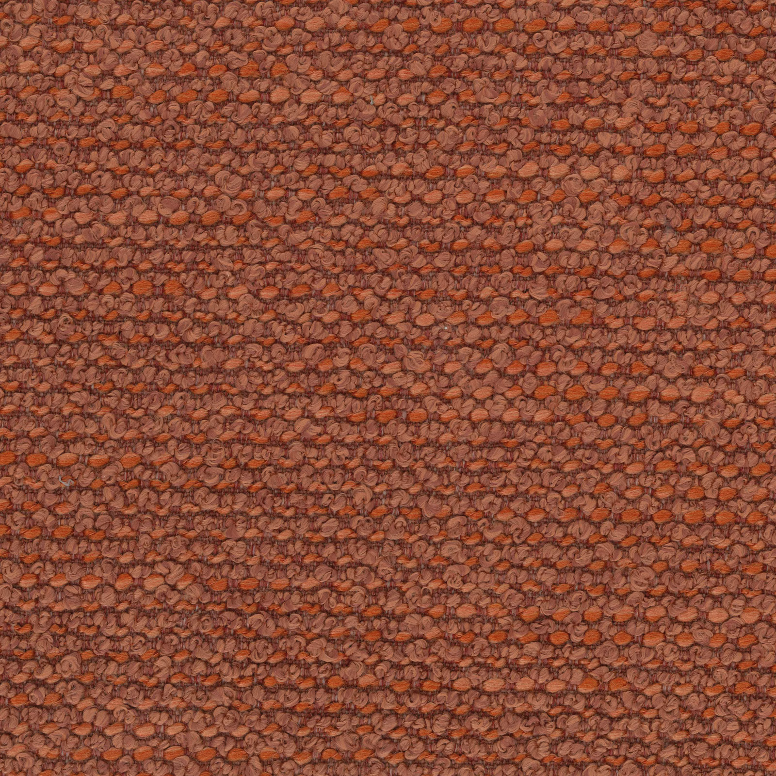 Close-up of textured terracotta bouclé-style fabric with rusty orange flecks