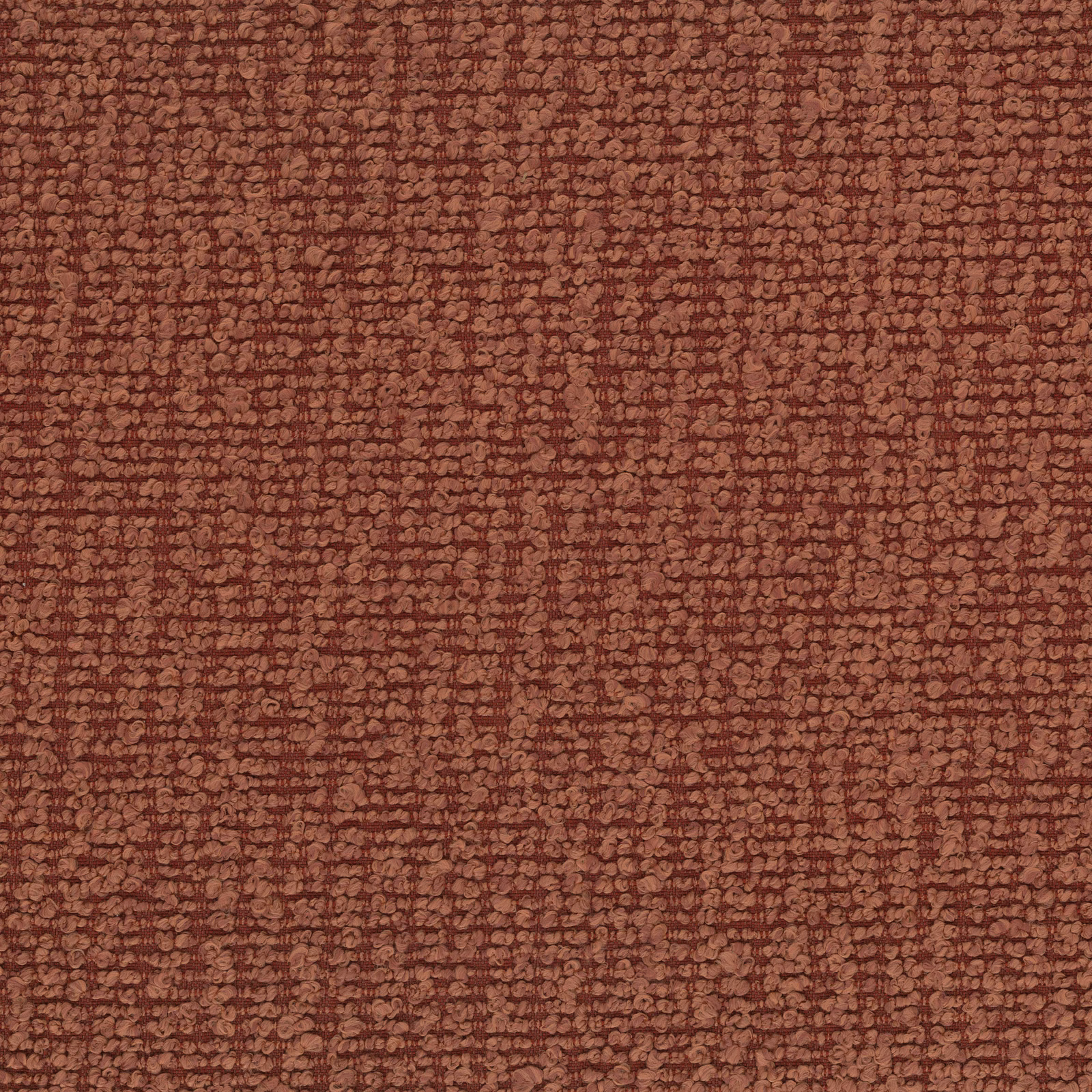 Close-up of textured terracotta upholstery fabric with a small-scale bouclé-like weave