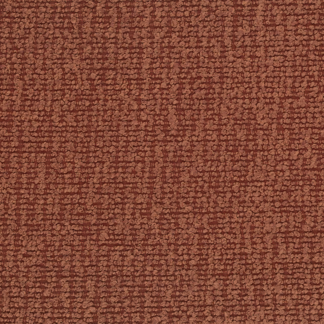Close-up of textured terracotta upholstery fabric with a small-scale bouclé-like weave