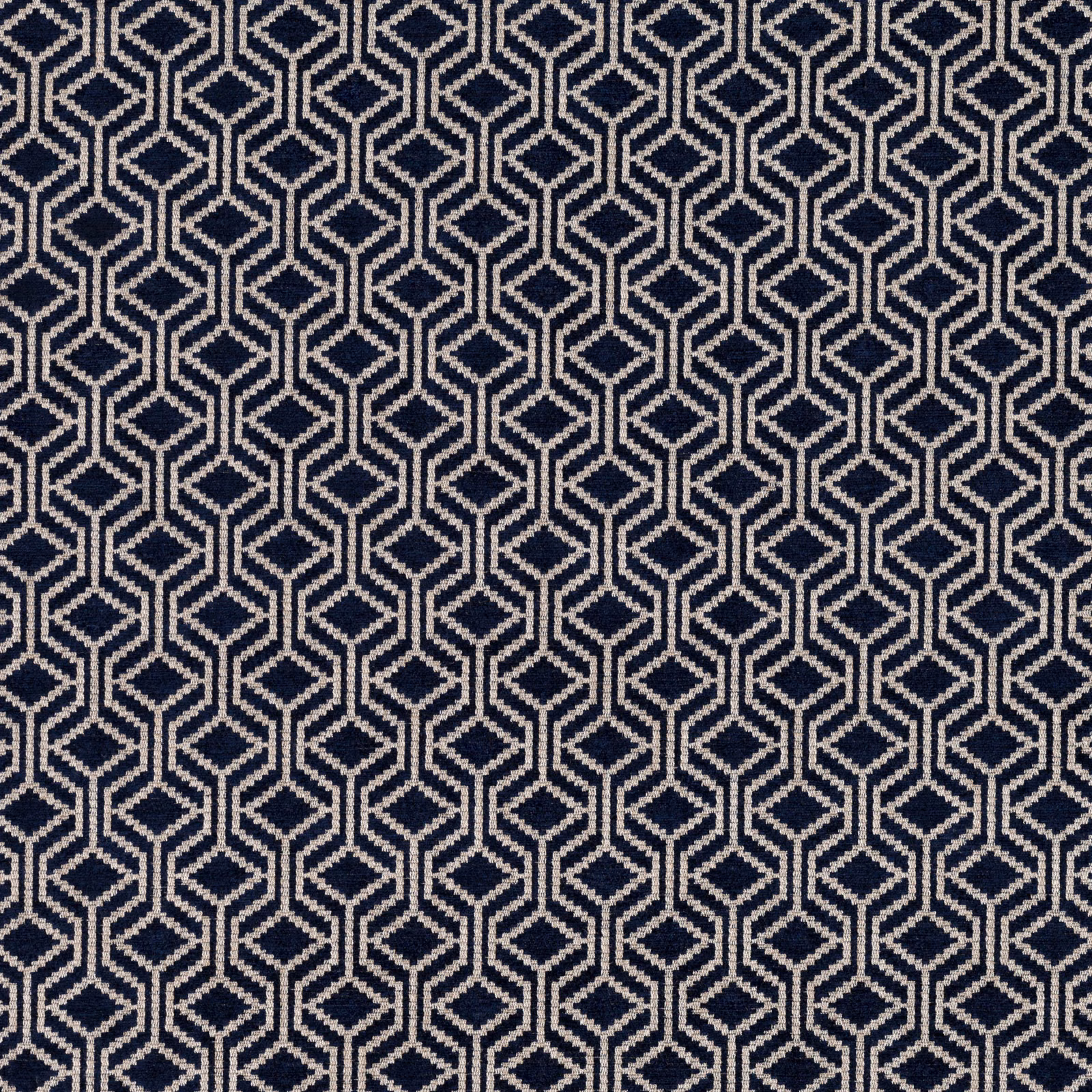Deep navy fabric with repeating ivory interlocking diamond and hexagon lattice