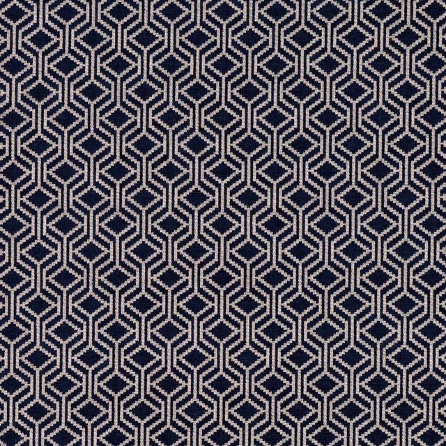 Deep navy fabric with repeating ivory interlocking diamond and hexagon lattice