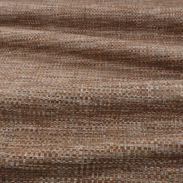Warm cinnamon-brown woven swatch with cream flecks and a tactile gridded surface