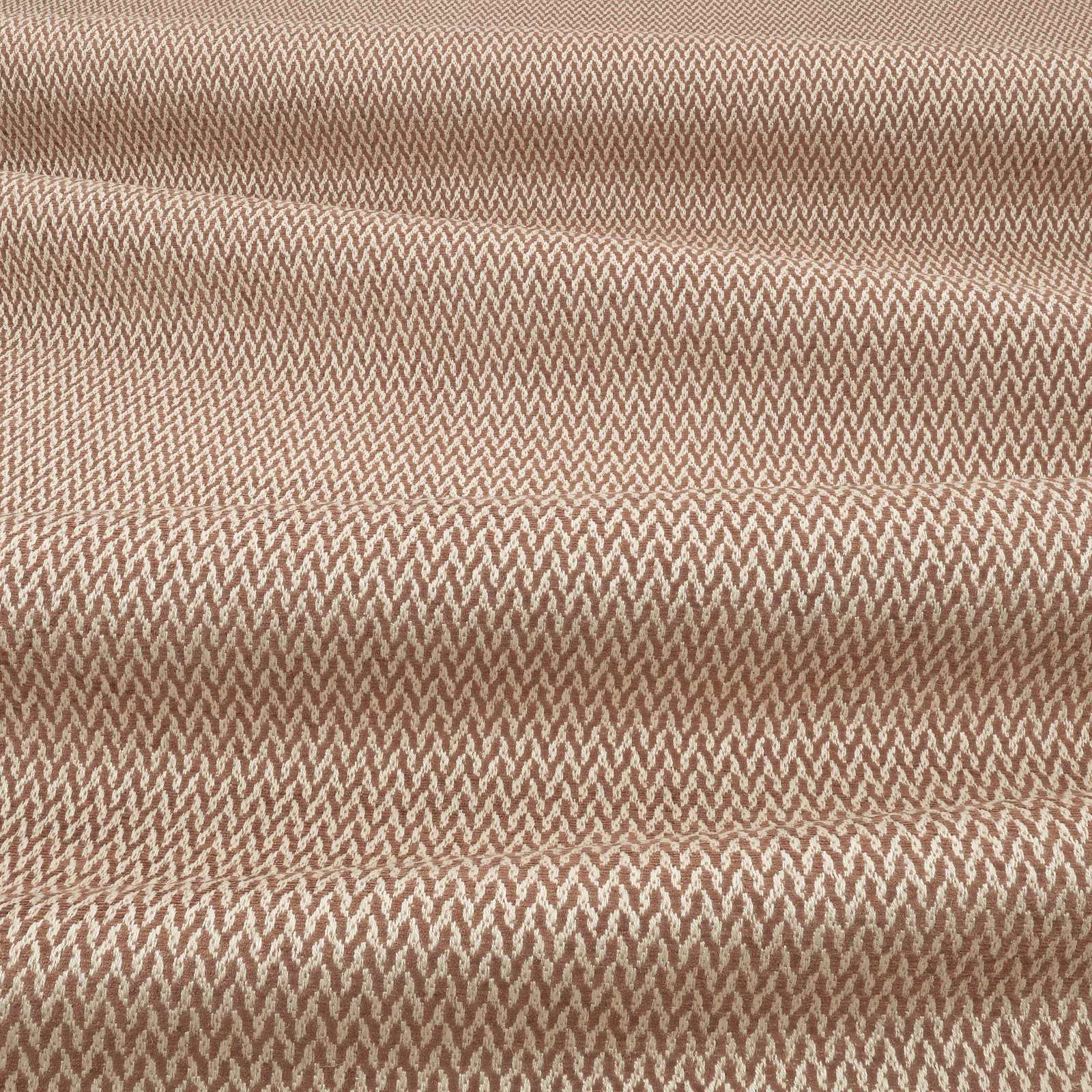 Warm cinnamon-brown woven textile with a fine, light-catching chevron texture