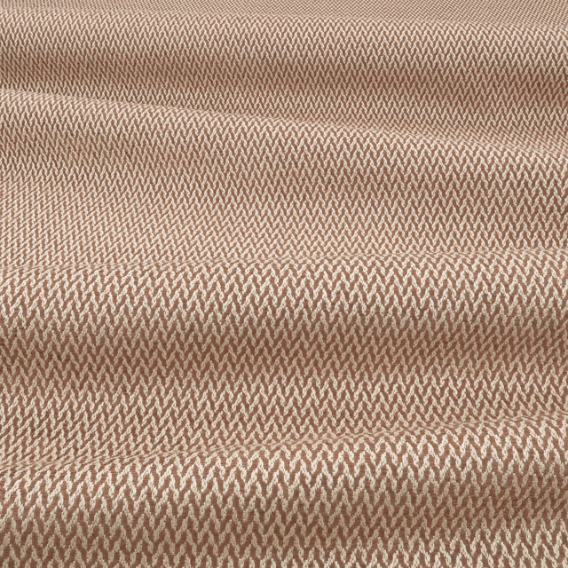 Warm cinnamon-brown woven textile with a fine, light-catching chevron texture