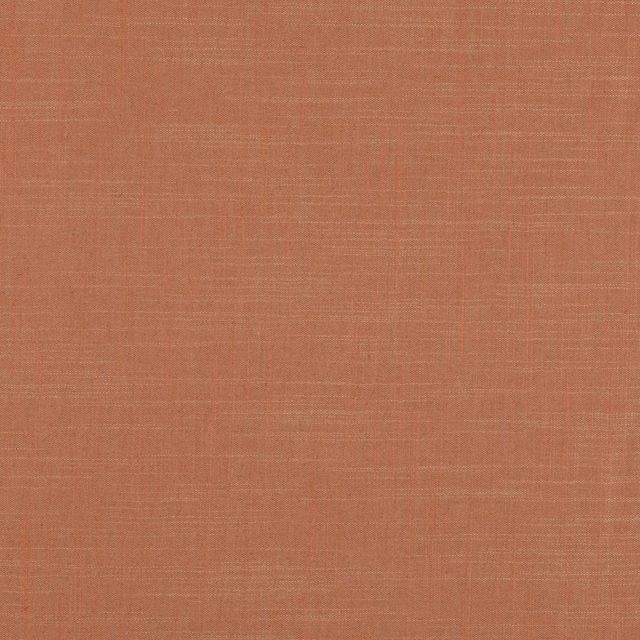 Muted henna terracotta fabric with fine crosshatched woven texture