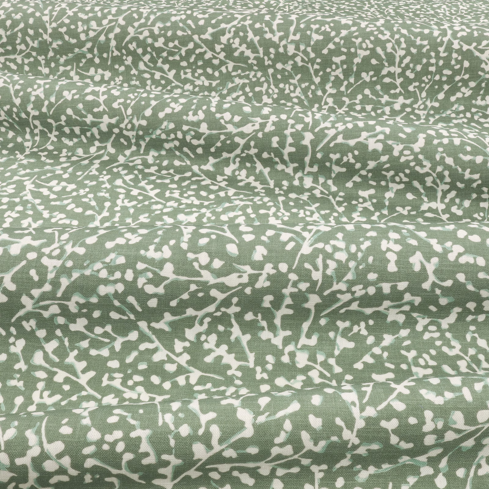 Dill-green and ivory abstract branching pattern across a softly folded fabric swatch