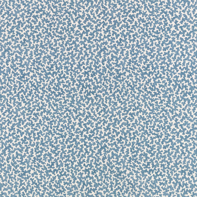 Pale blue fabric densely covered in tiny irregular darker blue flecks