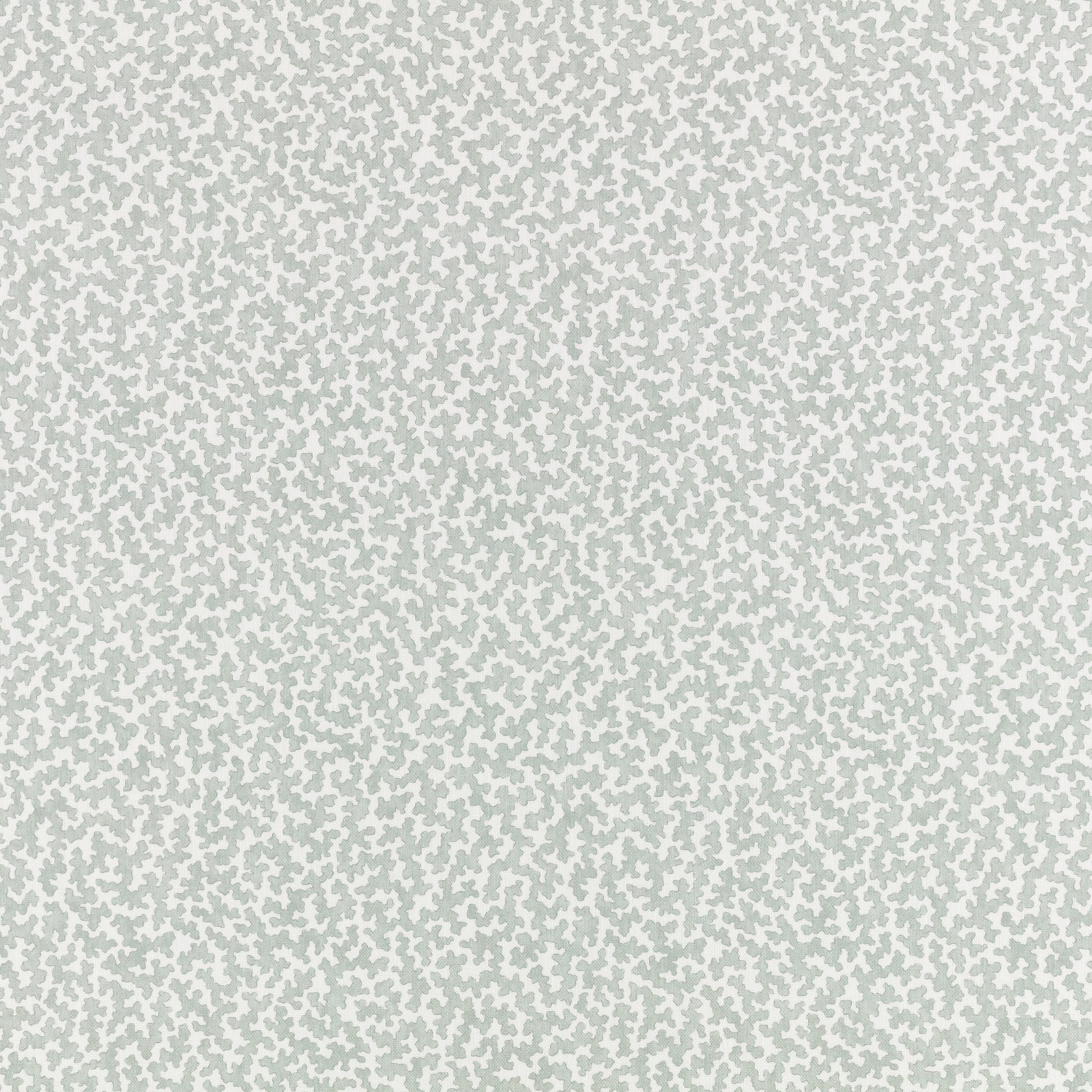 Pale mineral sage fabric with tiny irregular flecks over a soft ivory ground