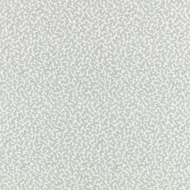 Pale mineral sage fabric with tiny irregular flecks over a soft ivory ground