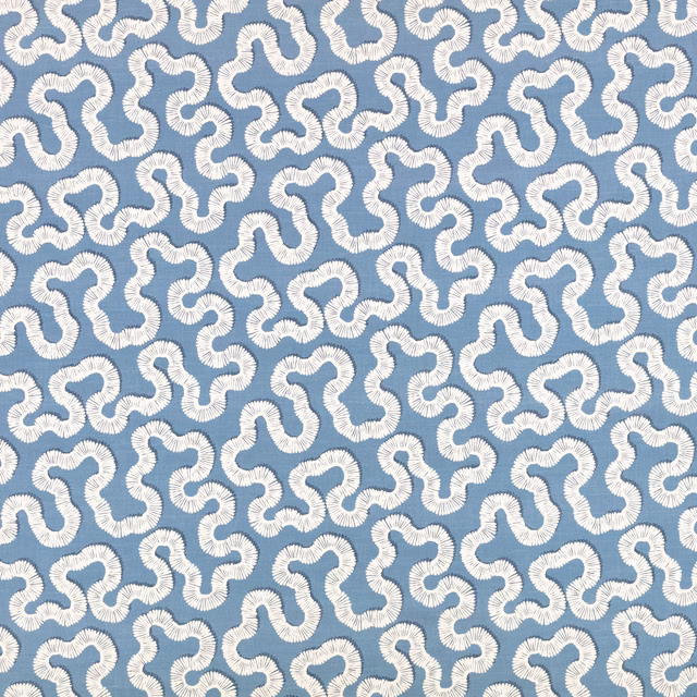 Cool Boathouse Blue textile with ivory looping motifs and a ridged woven texture