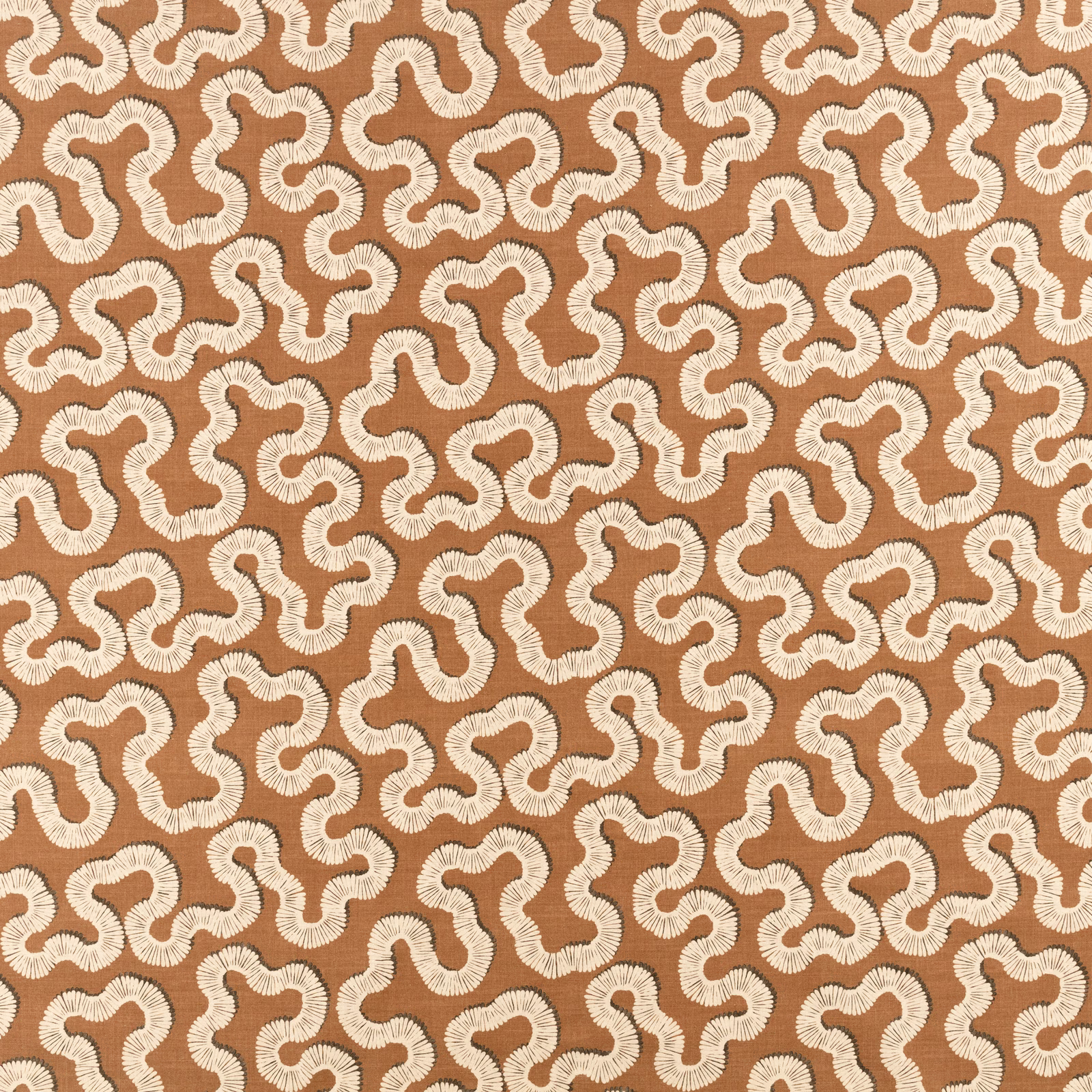 Warm copper textile with ivory looping motifs and softly ribbed woven texture