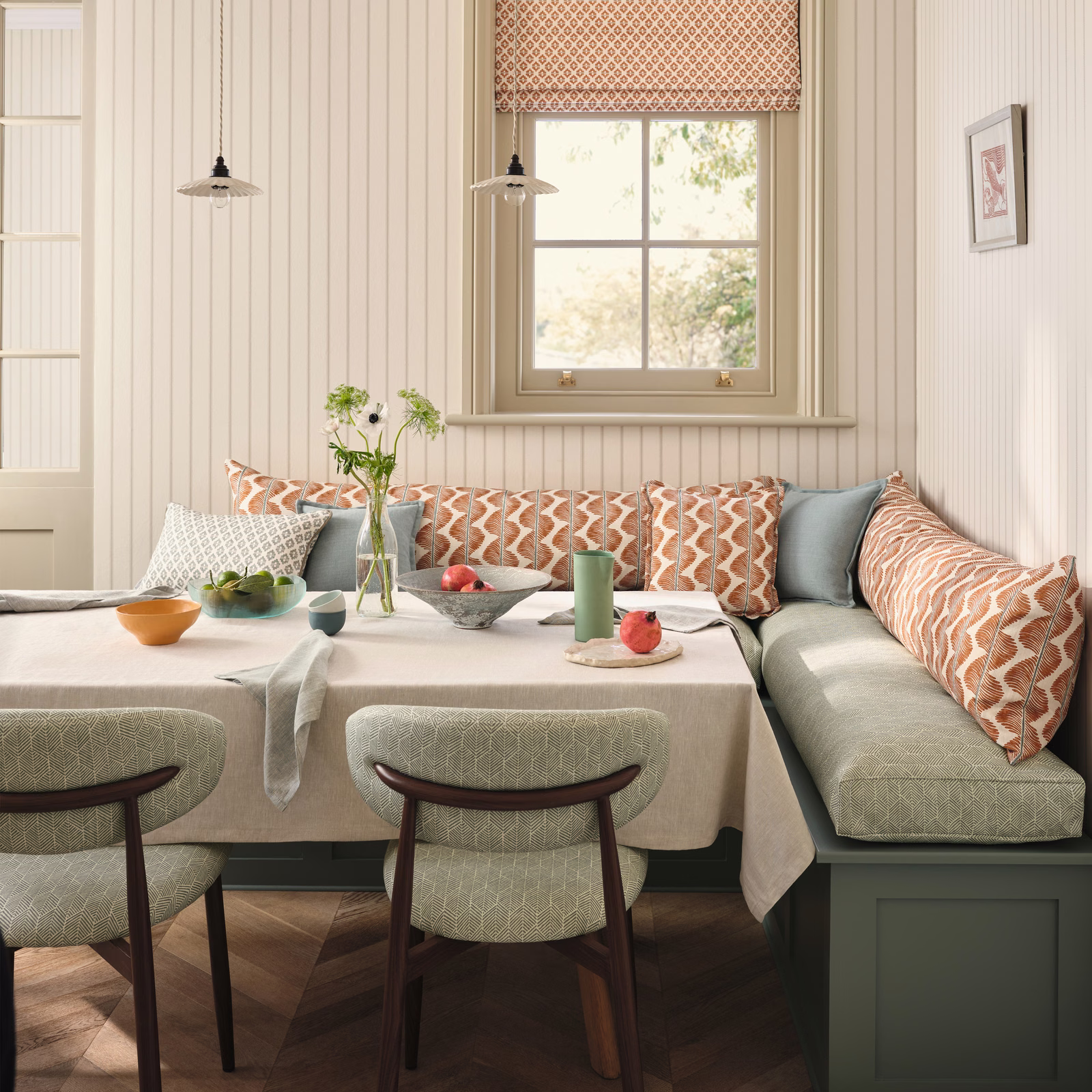 Cream, rust and sage geometric zigzag textile on cushions and Roman blind