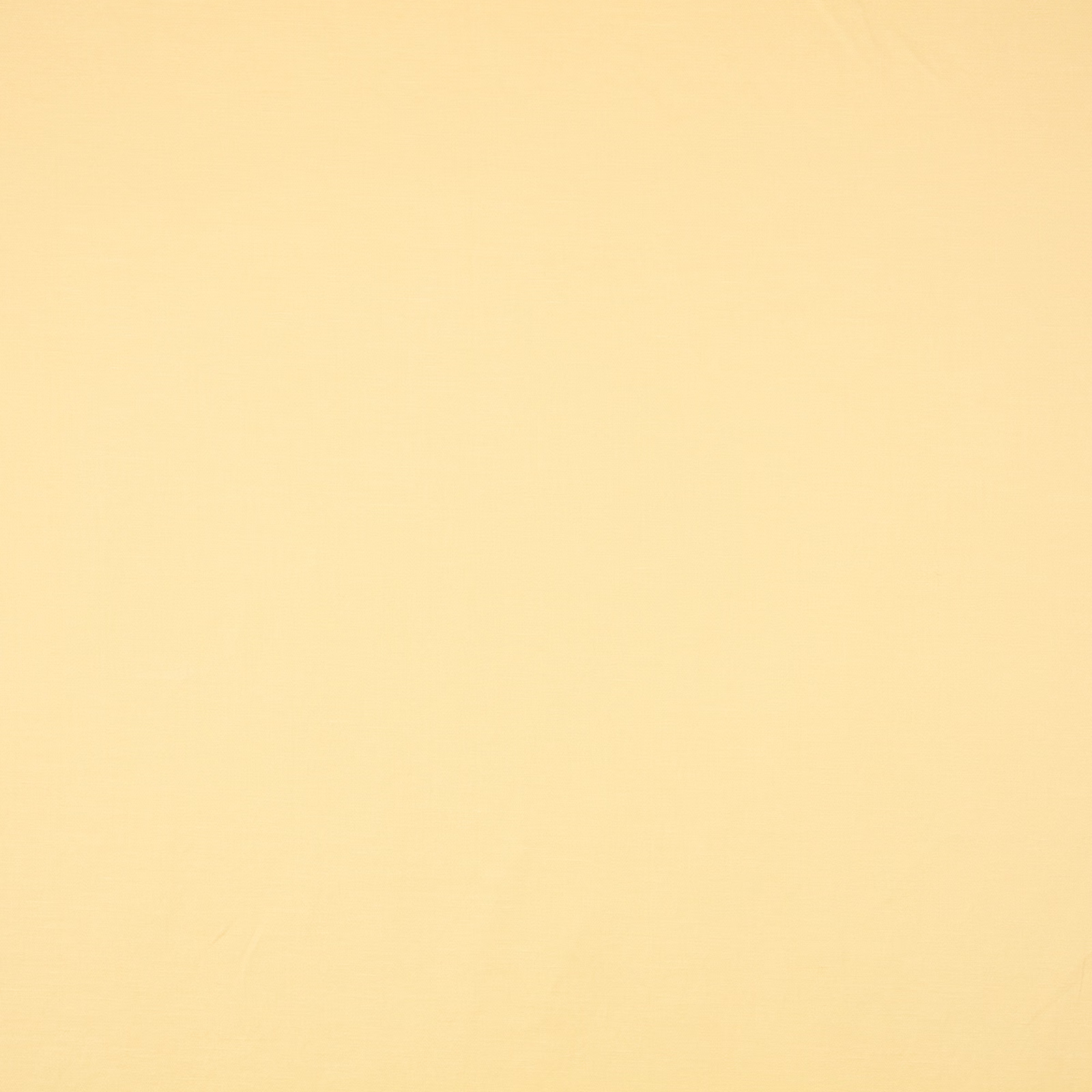 Pale butter-yellow plain weave with a fine, softly textured surface