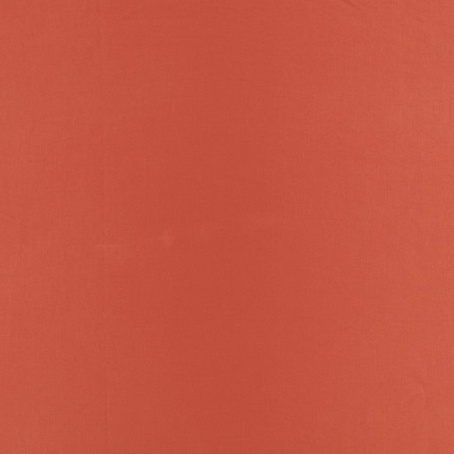 Warm coral-red plain weave with a subtly textured surface and even pimento tone