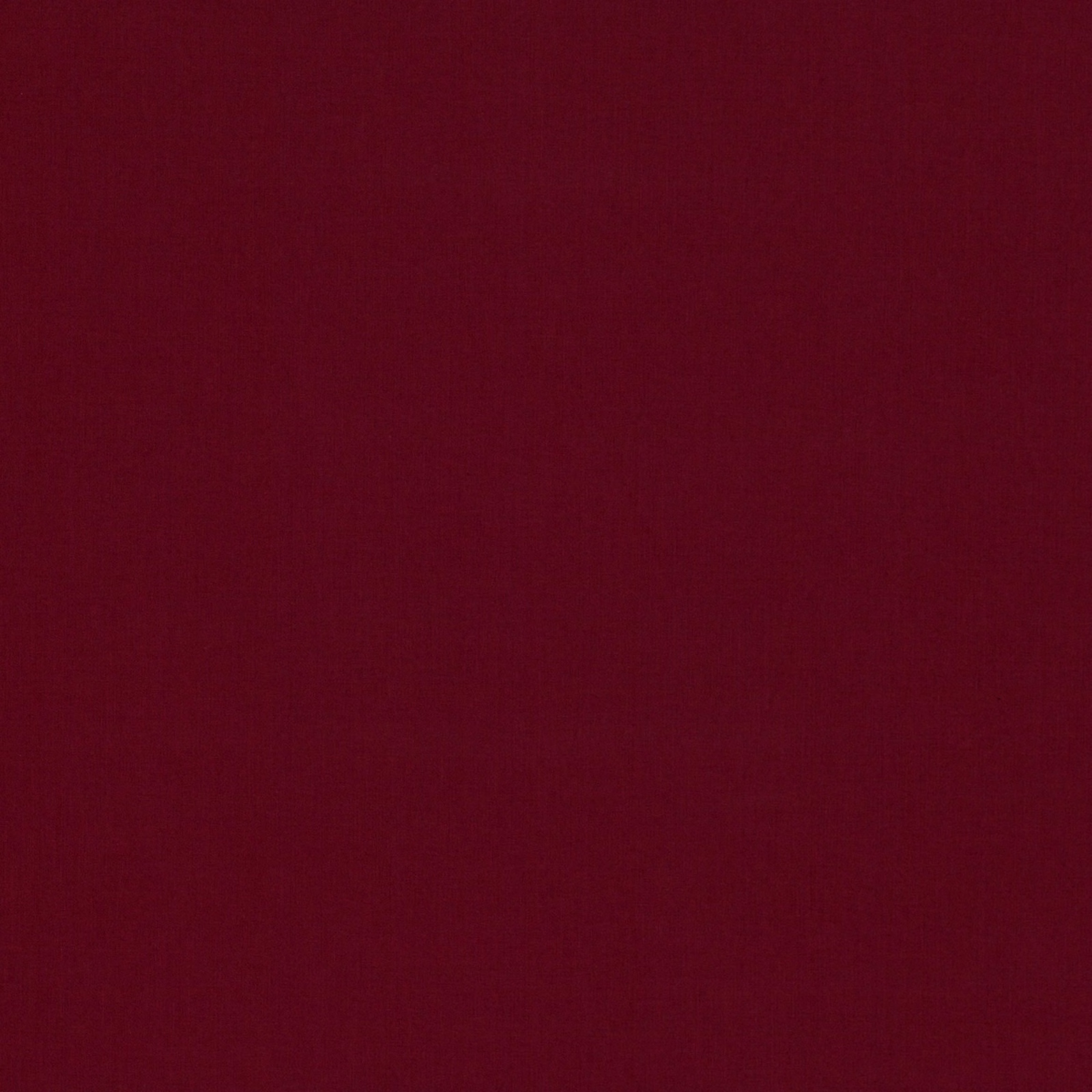 Deep burgundy-red plain woven fabric showing a subtle even surface texture