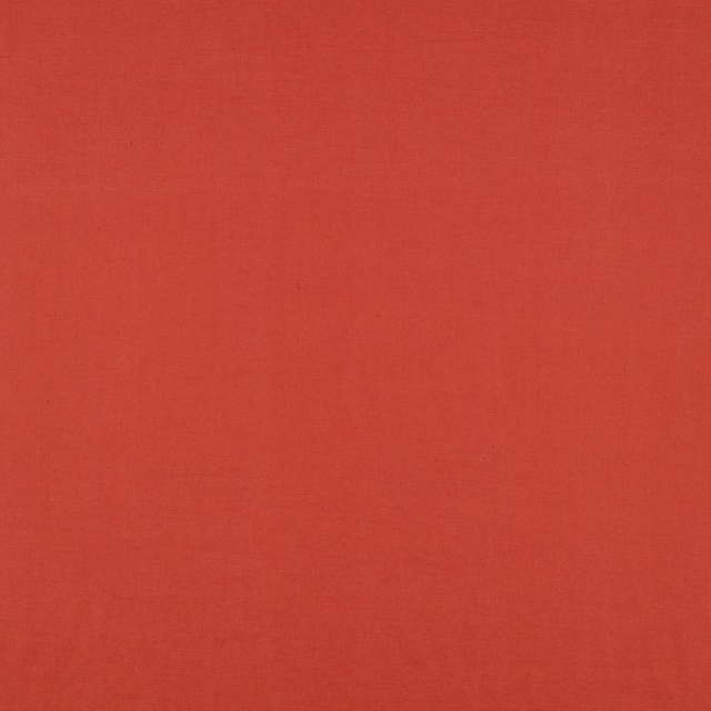 Warm brick-red plain woven fabric with subtle tonal texture across the swatch