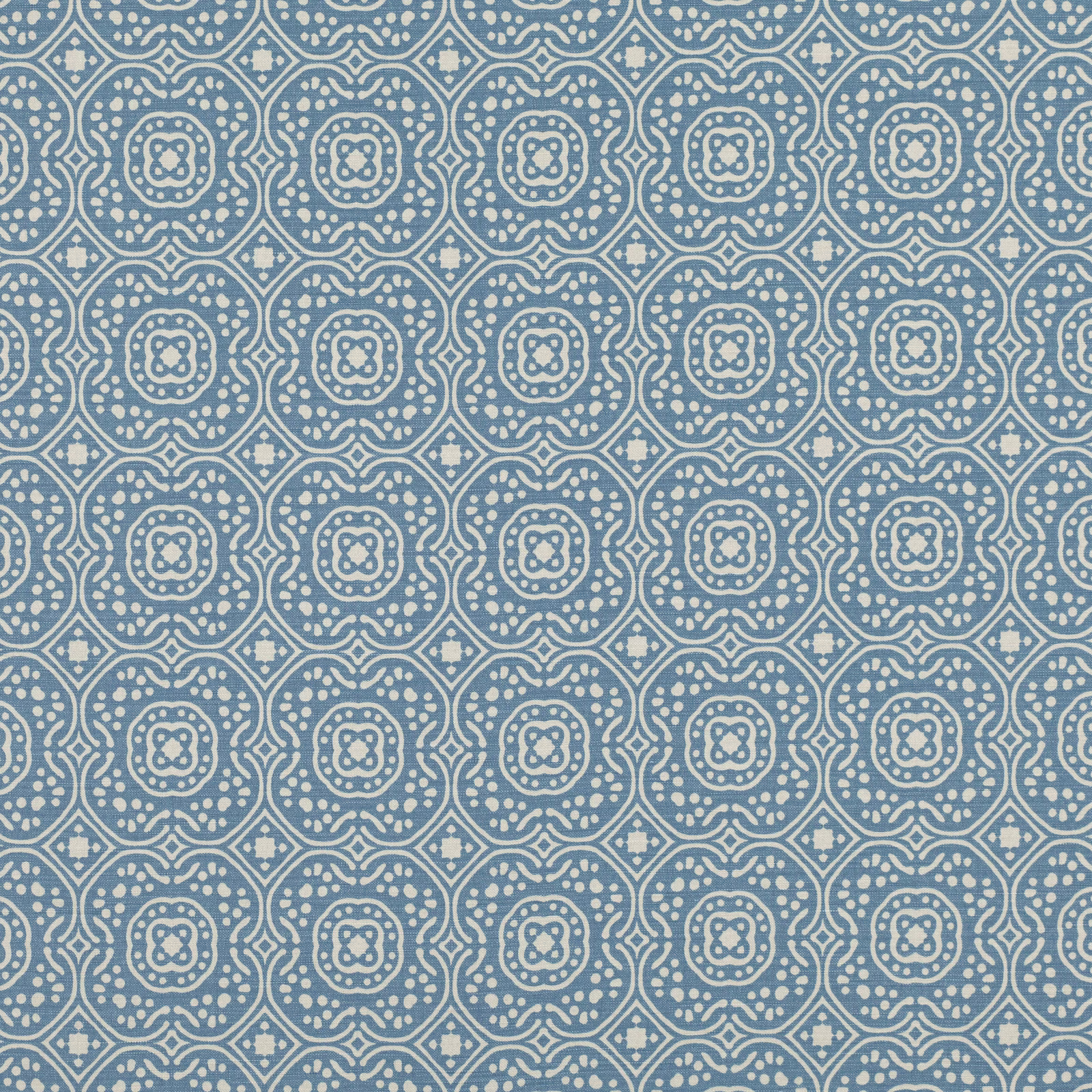 Dusky Oxford blue fabric with ivory dotted medallions in a geometric lattice