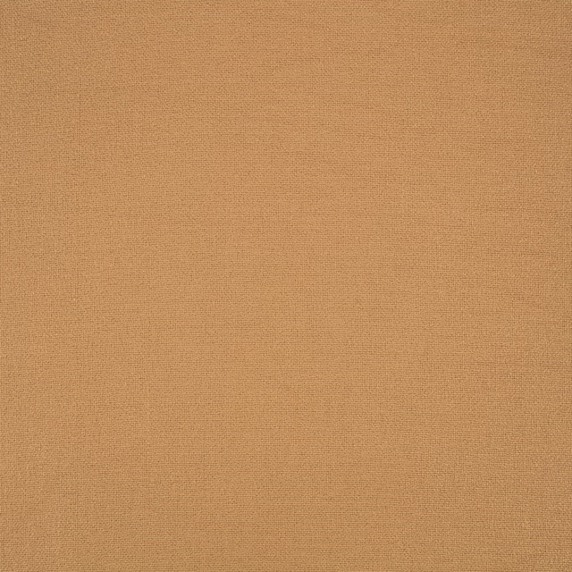 Close-up of warm copper-brown Elio fabric showing a fine, even woven texture
