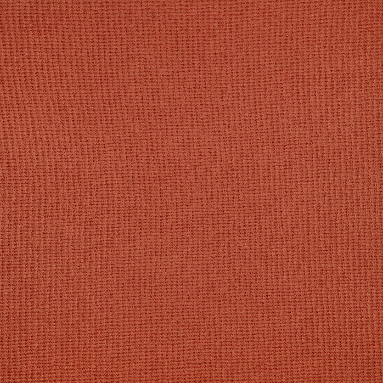 Close-up of russet terracotta fabric with a fine, softly varied woven texture