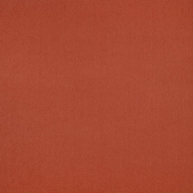 Close-up of russet terracotta fabric with a fine, softly varied woven texture