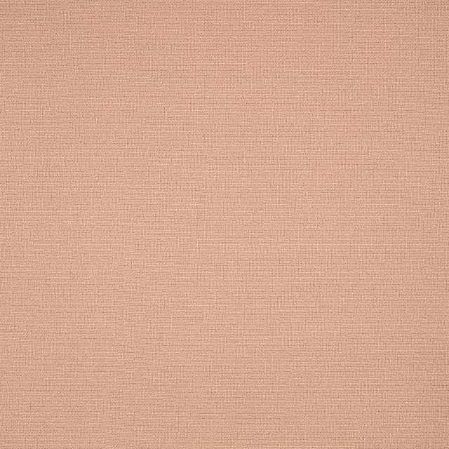 Close-up of finely woven muted Tuscan pink fabric with a soft matte surface