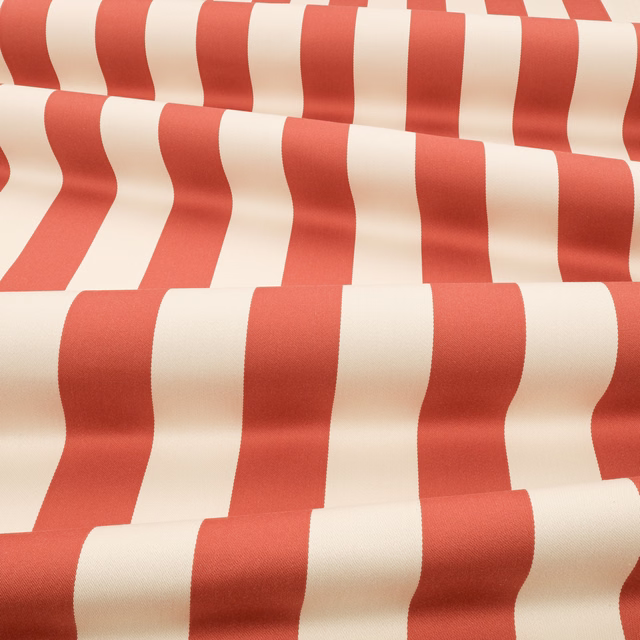 Warm pimento-red and ivory wavy vertical stripes on a softly textured fabric