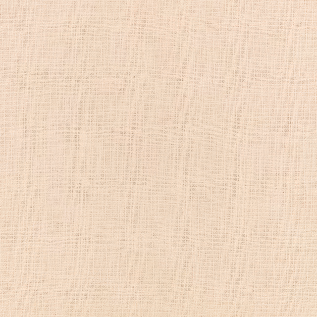 Pale warm ivory fabric with a delicate peach-toned crosshatched weave
