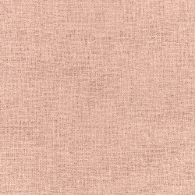 Close-up of soft wild-rose pink fabric with a fine crosshatched woven texture