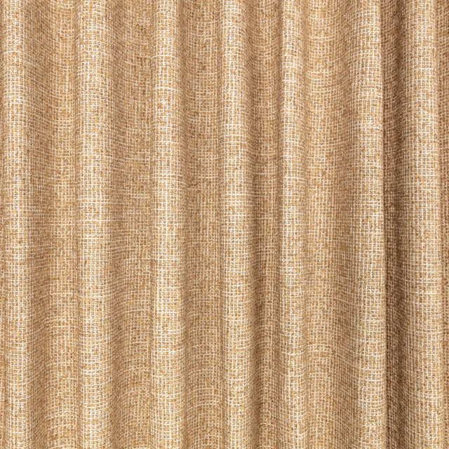 Warm tamarind tan woven fabric showing irregular texture in deep vertical folds