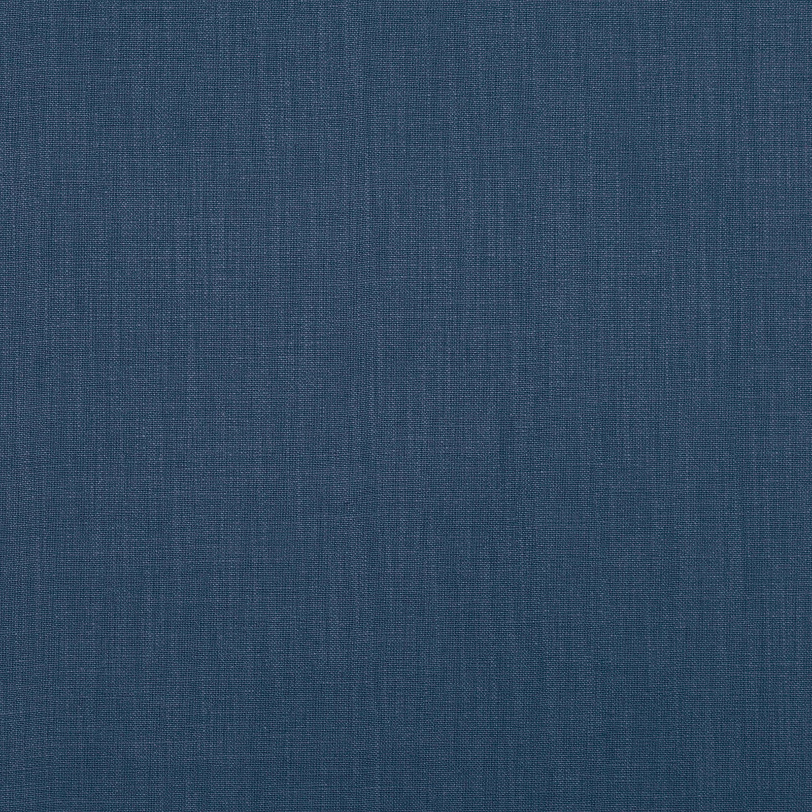 Deep indigo woven textile with fine vertical slubs and a softly mottled surface