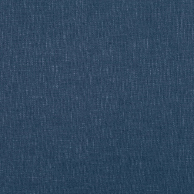 Deep indigo woven textile with fine vertical slubs and a softly mottled surface
