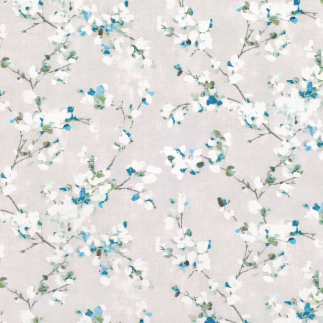 Stone-grey floral fabric with white blossoms and peacock-blue accents