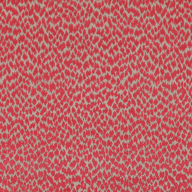 Close-up of carnelian red fabric with a small irregular warm-grey woven pattern