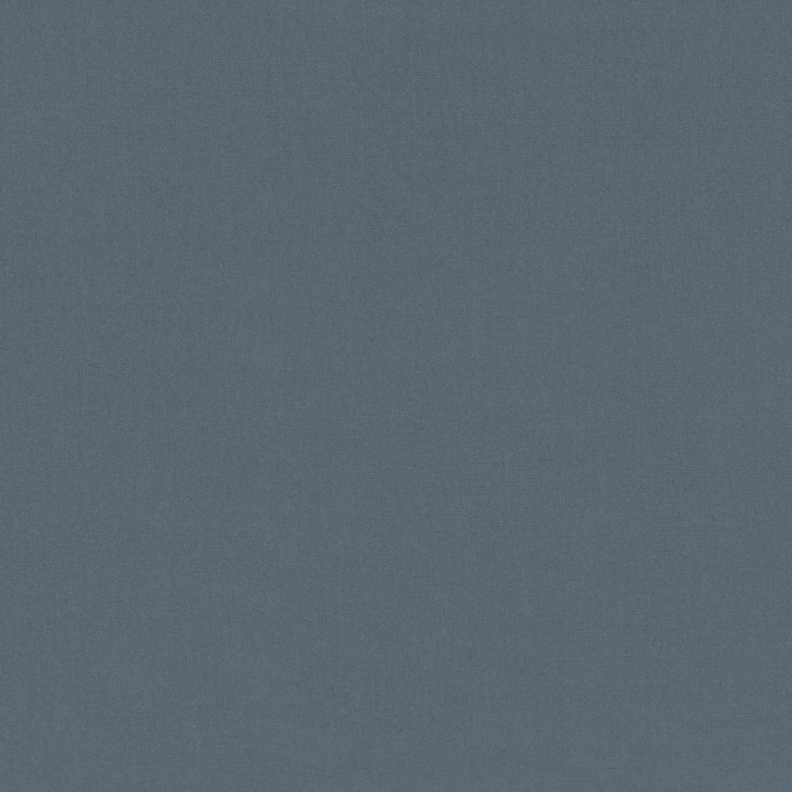 Close-up of muted slate-blue fabric with a fine, softly mottled surface