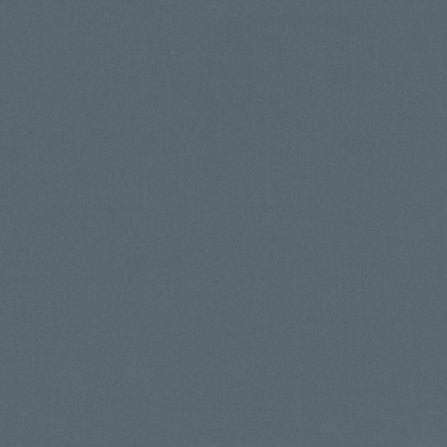 Close-up of muted slate-blue fabric with a fine, softly mottled surface