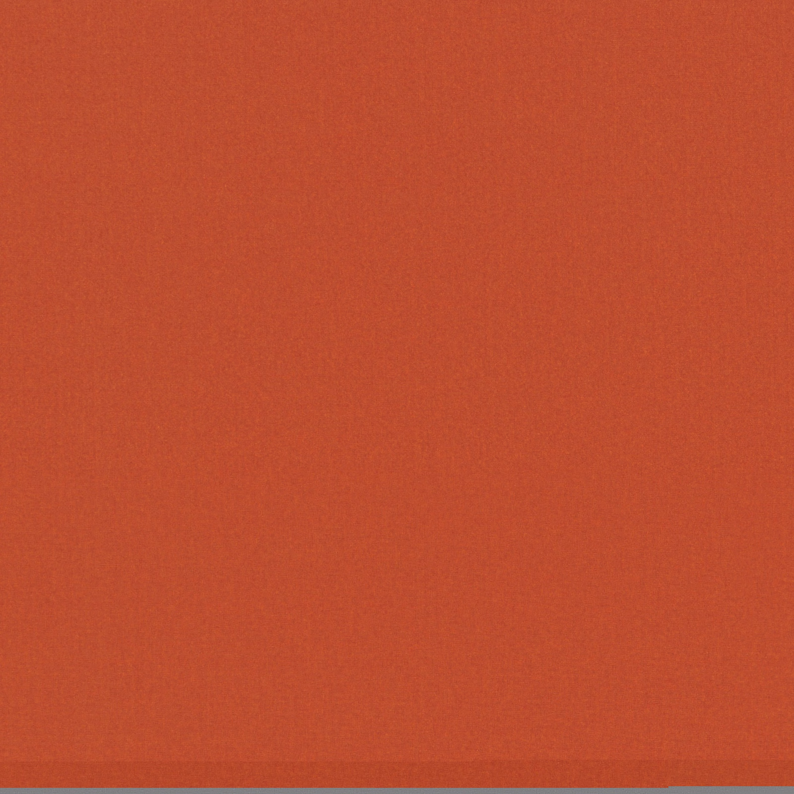 Close view of plain terracotta-orange textile with a fine, softly mottled weave