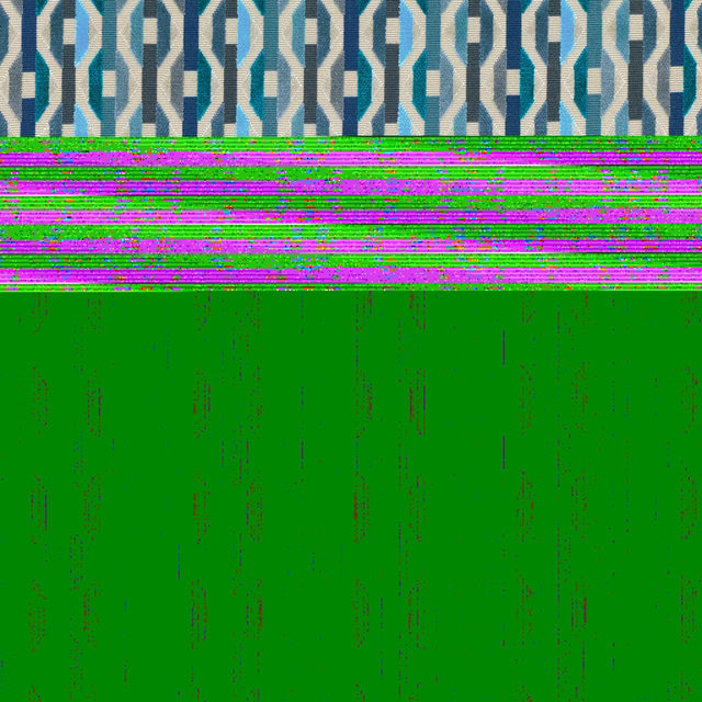 Cream woven fabric with repeating teal and deep blue interlocking geometric motifs