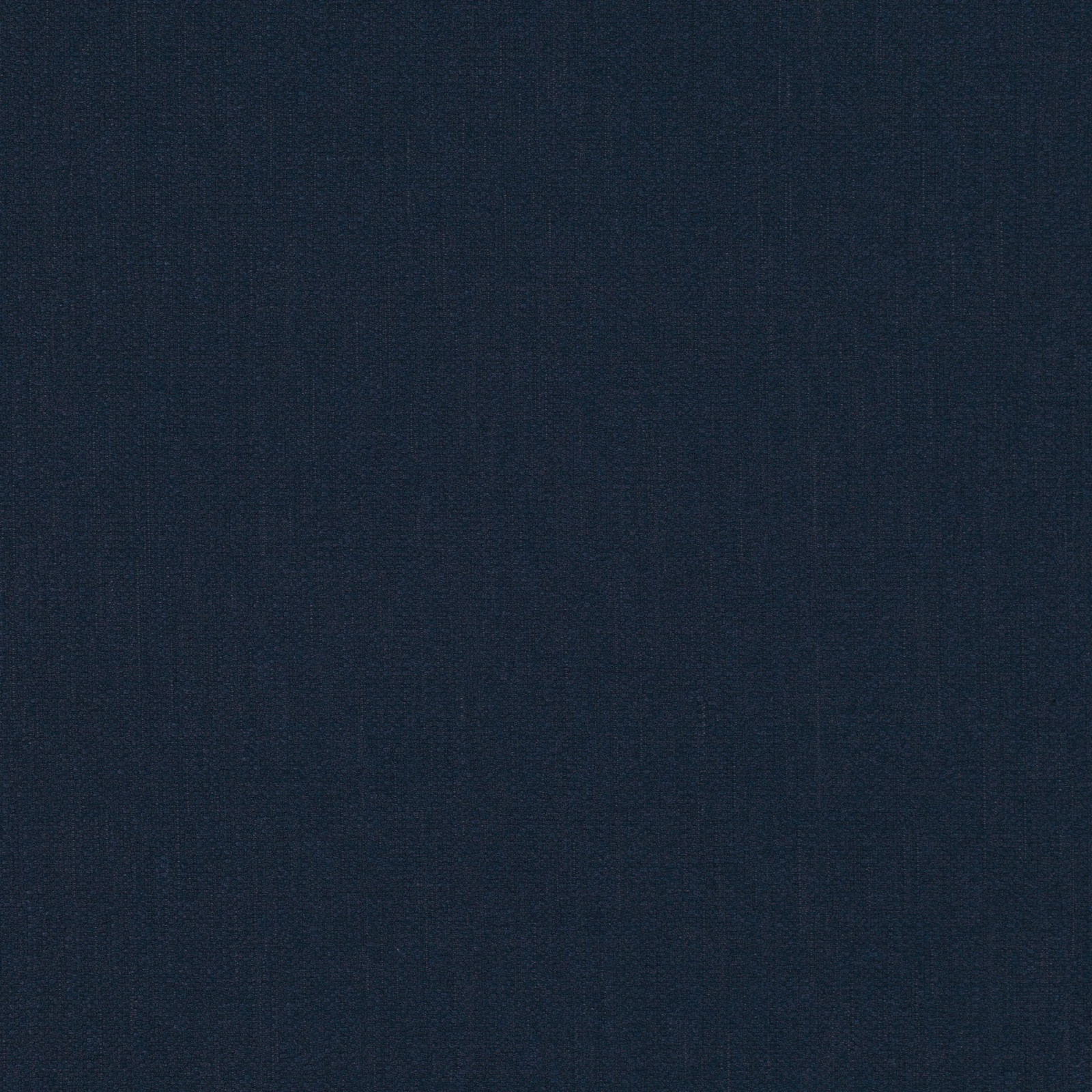 Close-up of deep indigo blue fabric with subtle fine woven texture