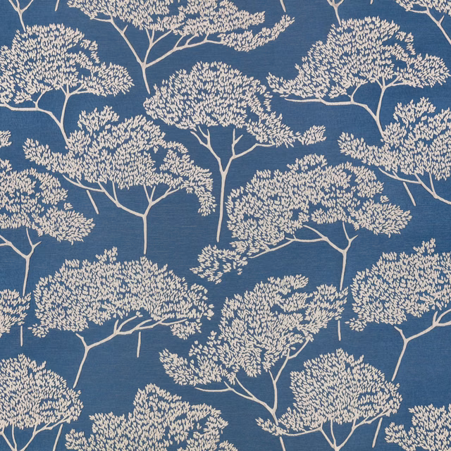 Ivory branching tree motifs across ink-blue, lightly textured Itami Batik fabric