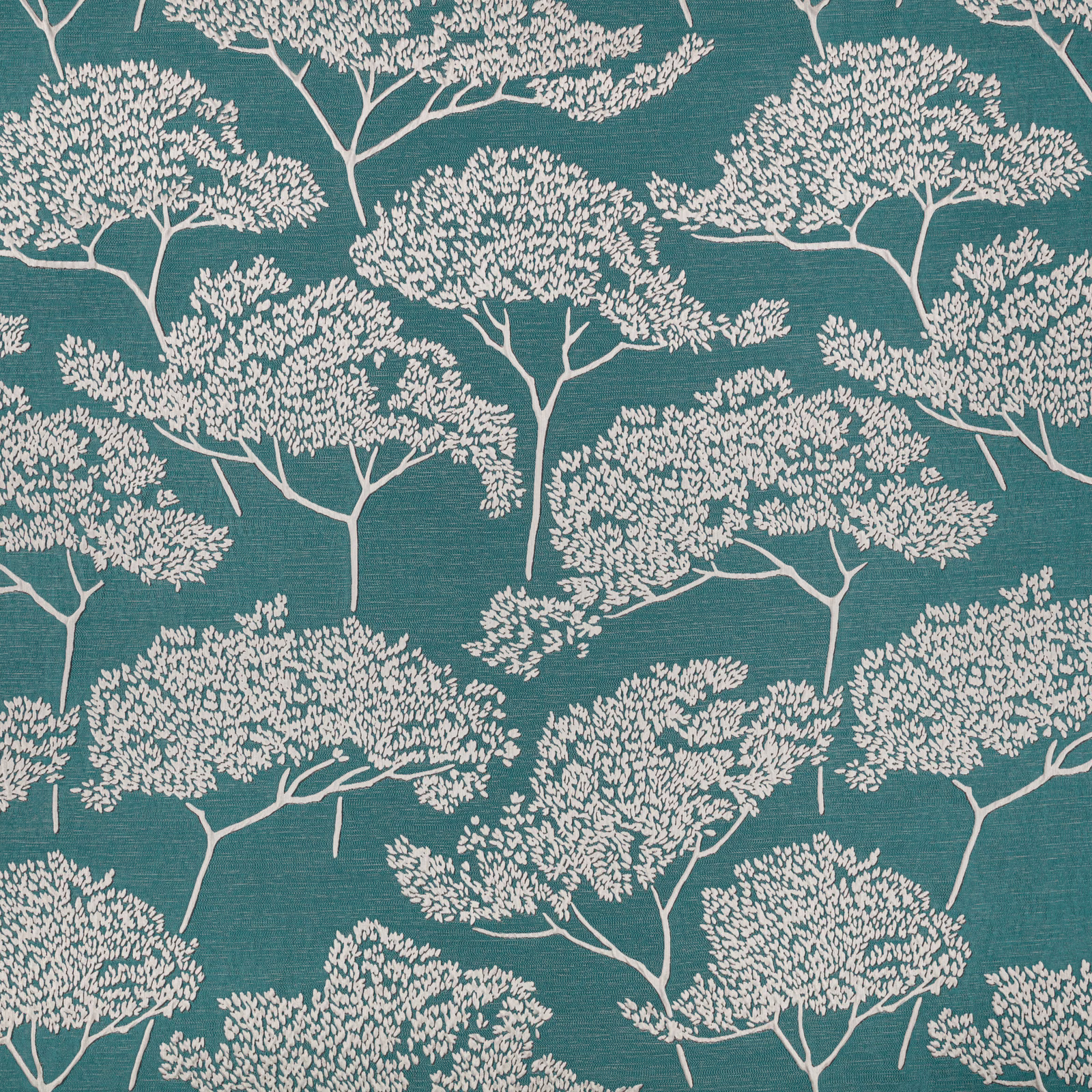 Deep Indian green fabric with ivory branching trees and a fine horizontal texture