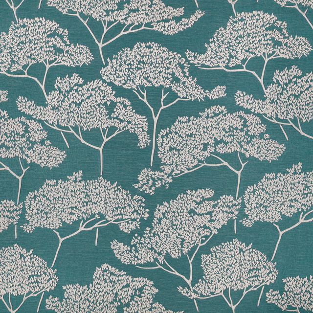 Deep Indian green fabric with ivory branching trees and a fine horizontal texture