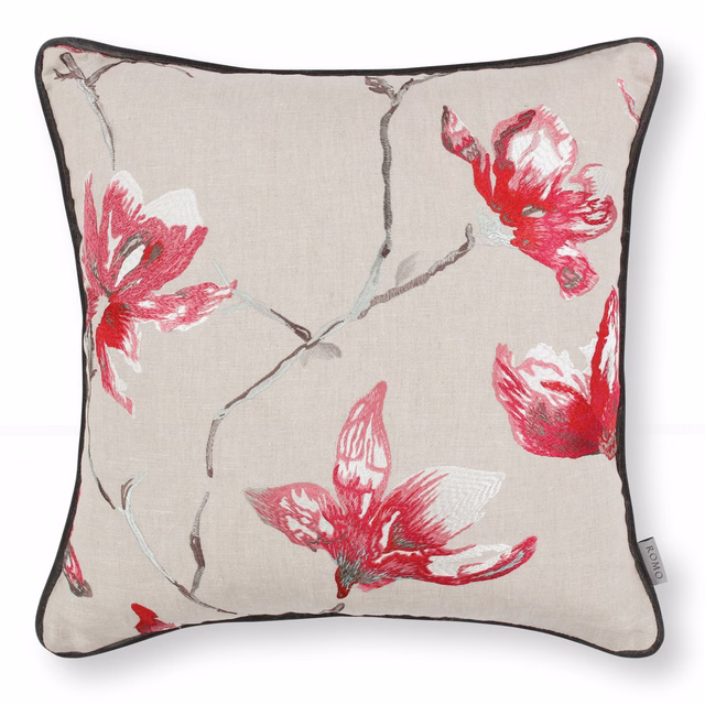 Warm taupe fabric with vivid red embroidered flowers and branching grey stems
